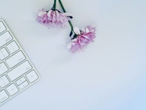 A keyboard and flowers